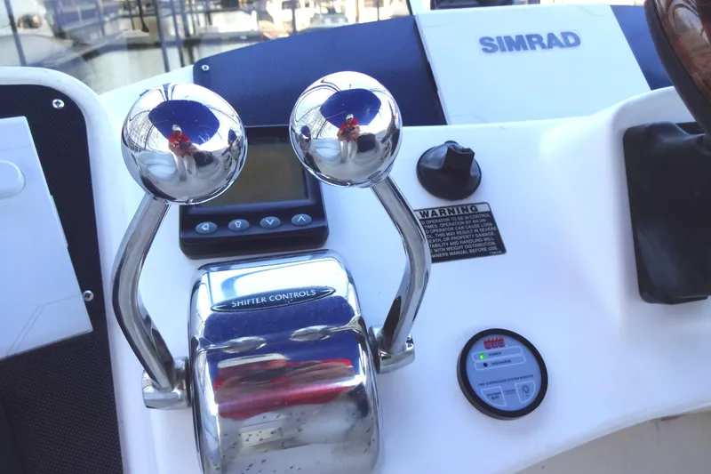 Slide: The Image of Control panel of a 2007 Meridian 459 yacht with Simrad navigation system. - 73