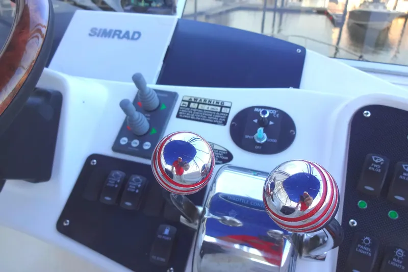 Slide: The Image of Control panel of a 2007 Meridian 459 yacht with Simrad navigation system. - 74