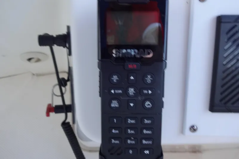 Slide: The Image of Simrad marine radio on a 2007 Meridian 459 yacht dashboard. - 75