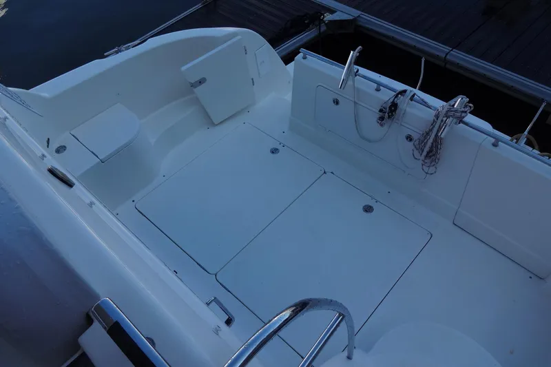 Slide: The Image of 2007 Meridian 459 yacht deck with storage compartments and railing. - 79