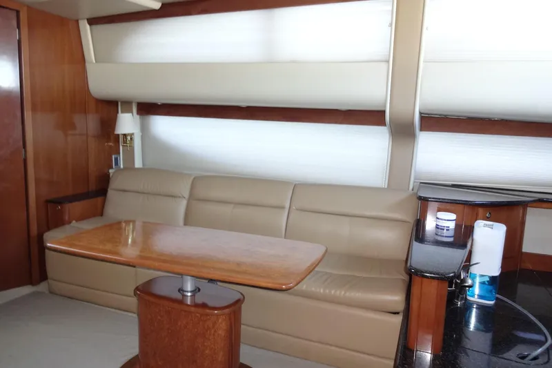 Slide: The Image of Luxurious interior of 2007 Meridian 459 yacht with leather seating and wooden table. - 89