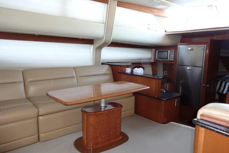 Slide: The Image of Luxurious interior of 2007 Meridian 459 yacht with leather seating and modern kitchen amenities. - 90