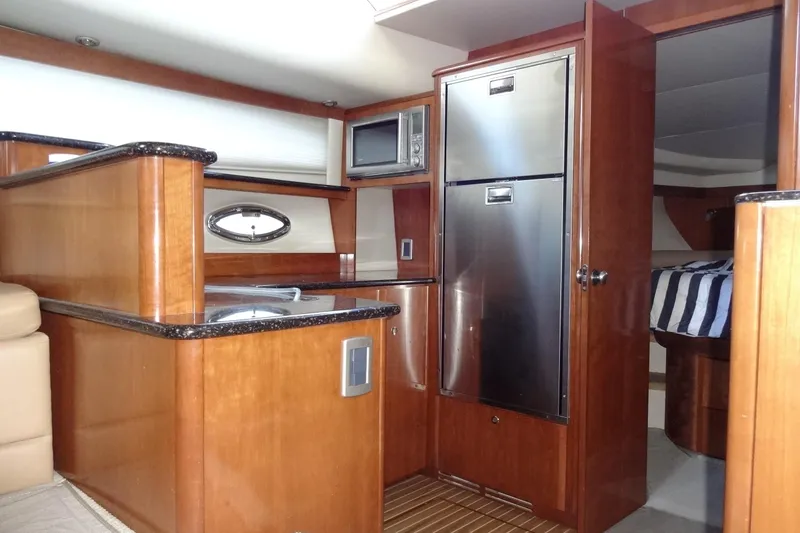 Slide: The Image of Luxurious 2007 Meridian 459 yacht interior with modern kitchen and cozy cabin. - 95