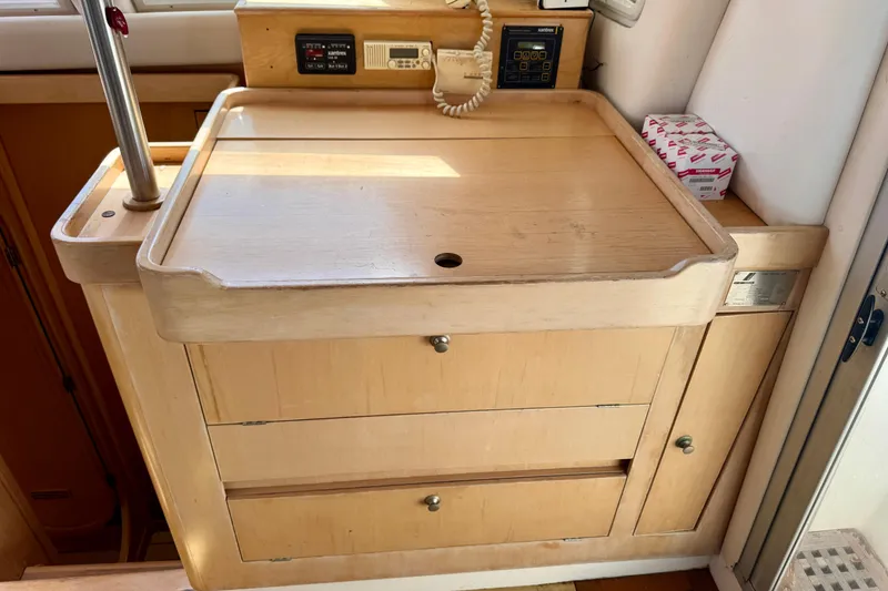 Slide: The Image of Interior of 1992 Wauquiez Kronos yacht with wooden cabinetry and control panels. - 19