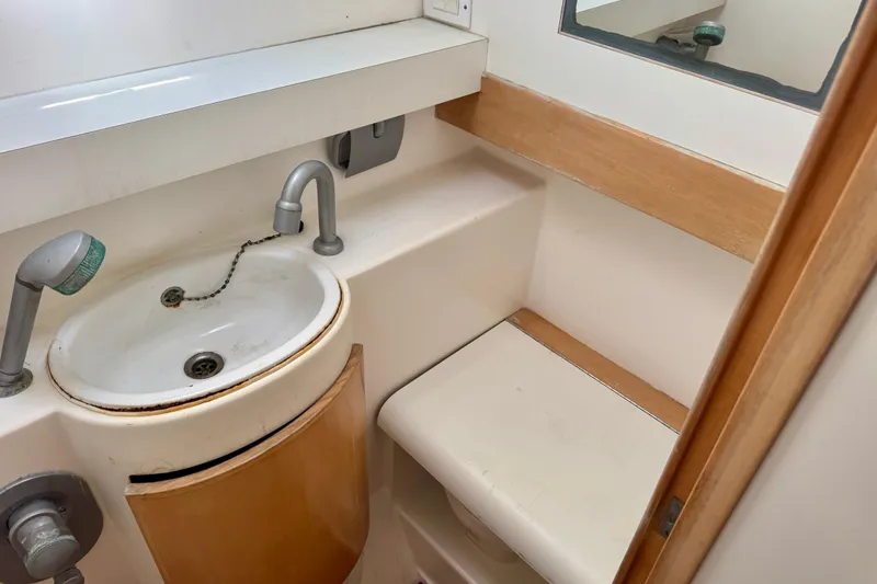 Slide: The Image of Compact bathroom in 1992 Wauquiez Kronos yacht with sink and mirror. - 24
