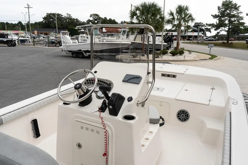 Slide: The Image of 2025 Carolina Skiff 19 LS boat interior with steering wheel and control panel. - 10