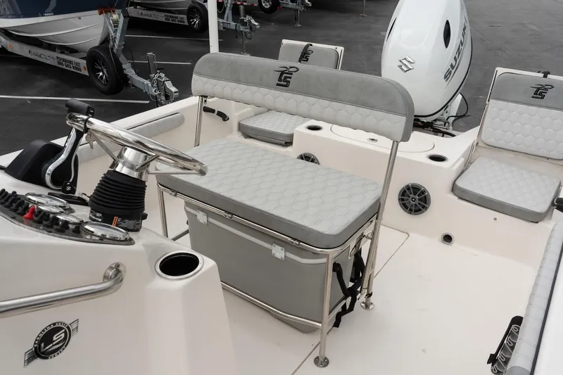 Slide: The Image of 2025 Carolina Skiff 19 LS boat interior with steering wheel and seating. - 12