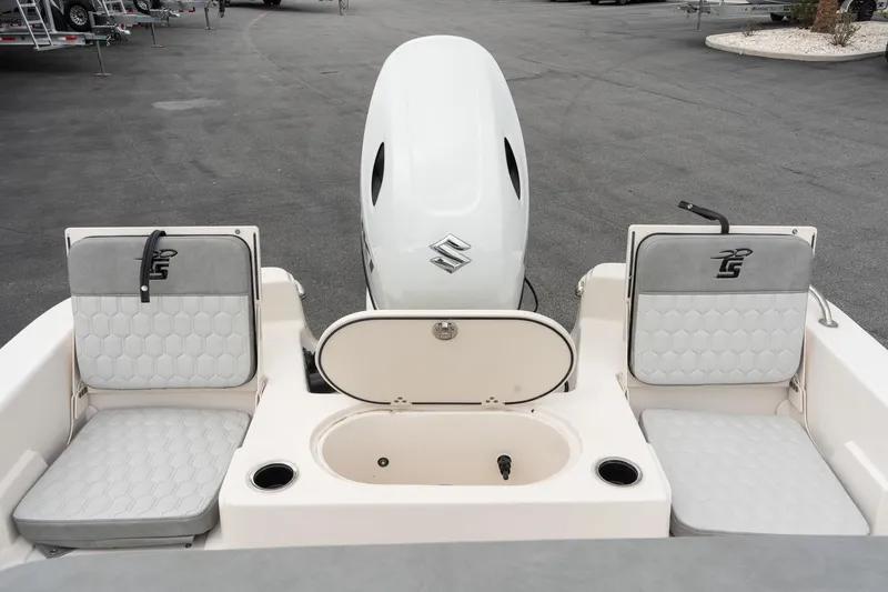 Slide: The Image of 2025 Carolina Skiff 19 LS boat interior with seating and motor, showcasing modern design. - 7