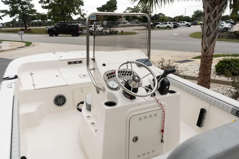 Slide: The Image of 2025 Carolina Skiff 19 LS boat interior with steering wheel and control panel. - 9