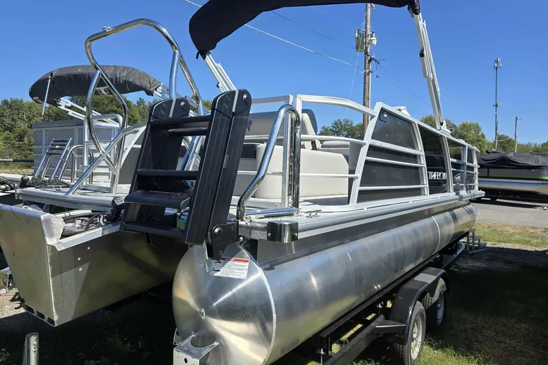 Slide: The Image of 2026 Trifecta 24ULLET275 pontoon boat on trailer, featuring sleek aluminum design. - 9