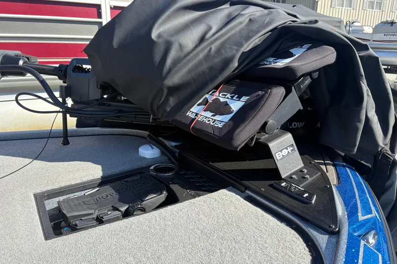 Slide: The Image of 2024 Nitro Z19 Pro boat deck with fishing equipment and cover. - 10