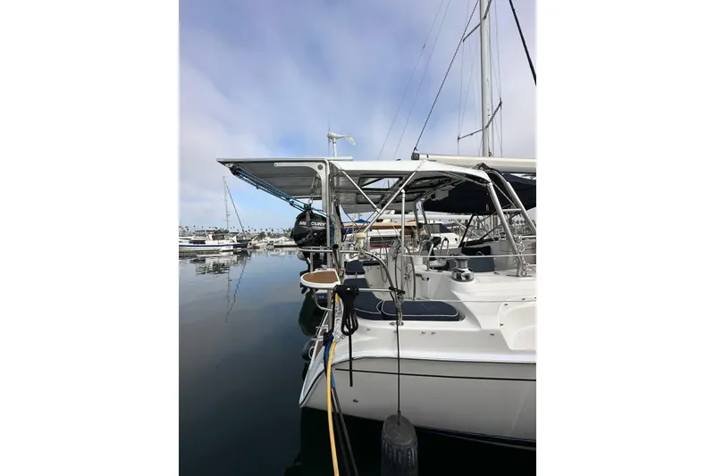 Slide: The Image of 2008 Hunter 49 yacht docked in marina, featuring sleek design and modern amenities. - 10