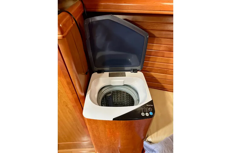 Slide: The Image of Compact washing machine in a 2008 Hunter 49 yacht interior. - 102