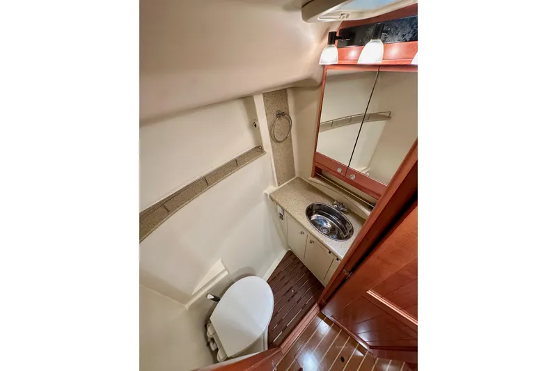 Slide: The Image of 2008 Hunter 49 yacht bathroom with sink, mirror, and toilet. - 105