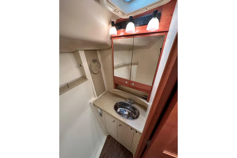 Slide: The Image of Compact bathroom in 2008 Hunter 49 yacht with mirror, sink, and lighting. - 106
