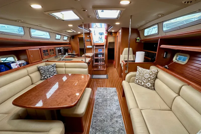 Slide: The Image of Luxurious interior of 2008 Hunter 49 yacht with elegant seating and dining area. - 109