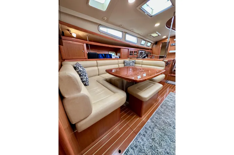 Slide: The Image of Luxurious interior of 2008 Hunter 49 yacht with elegant seating and wooden finishes. - 110