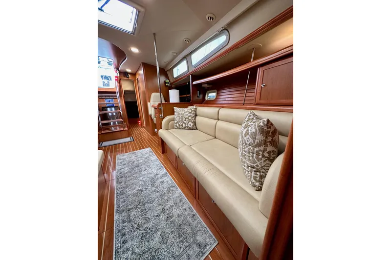 Slide: The Image of Luxurious interior of 2008 Hunter 49 yacht with elegant seating and wooden finishes. - 111