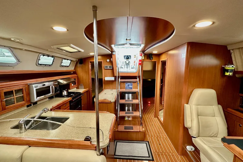 Slide: The Image of Luxurious interior of 2008 Hunter 49 yacht with modern kitchen and seating area. - 112