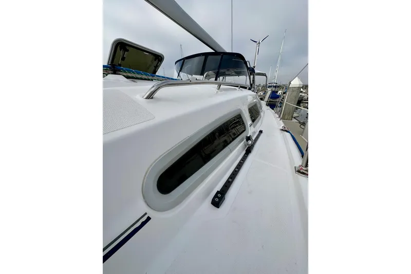 Slide: The Image of 2008 Hunter 49 sailboat deck view with sleek design and modern features. - 19