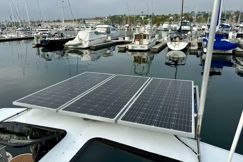 Slide: The Image of Solar panels on a 2008 Hunter 49 yacht docked at a marina. - 26