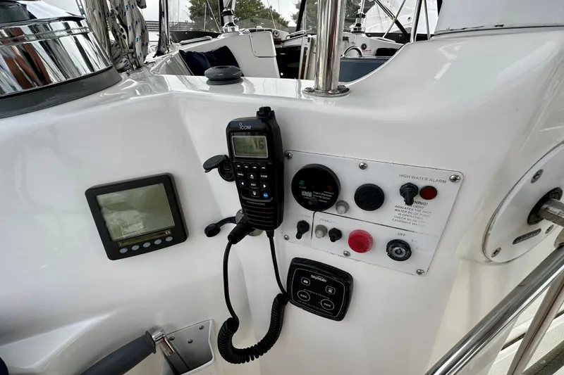 Slide: The Image of Control panel of a 2008 Hunter 49 yacht with radio and navigation instruments. - 32
