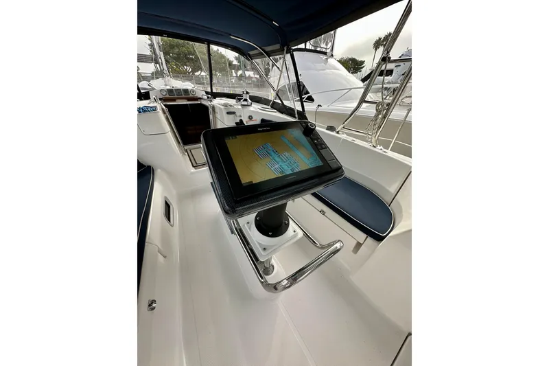 Slide: The Image of Cockpit of 2008 Hunter 49 sailboat with navigation display and seating. - 34
