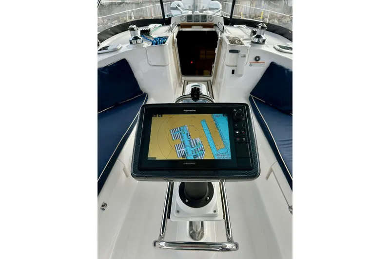 Slide: The Image of Cockpit of 2008 Hunter 49 yacht with navigation display and seating. - 35