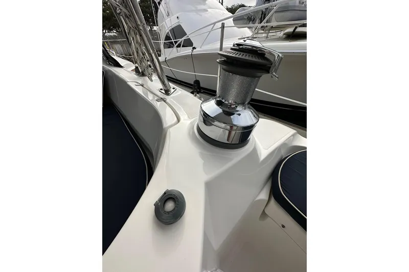 Slide: The Image of 2008 Hunter 49 sailboat deck with winch and railing details. - 37
