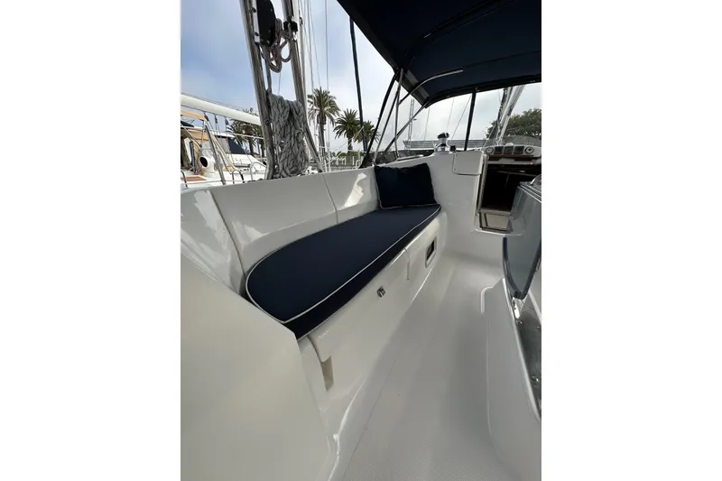 Slide: The Image of 2008 Hunter 49 sailboat cockpit with blue cushions and sleek design. - 38