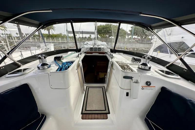 Slide: The Image of Interior view of 2008 Hunter 49 sailboat cockpit with winches and seating. - 42