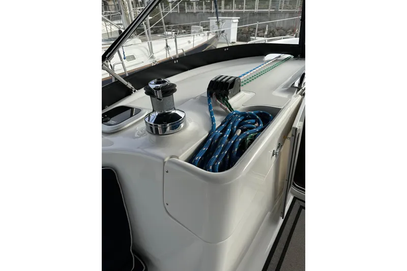 Slide: The Image of Deck of 2008 Hunter 49 sailboat with winch and coiled ropes. - 44