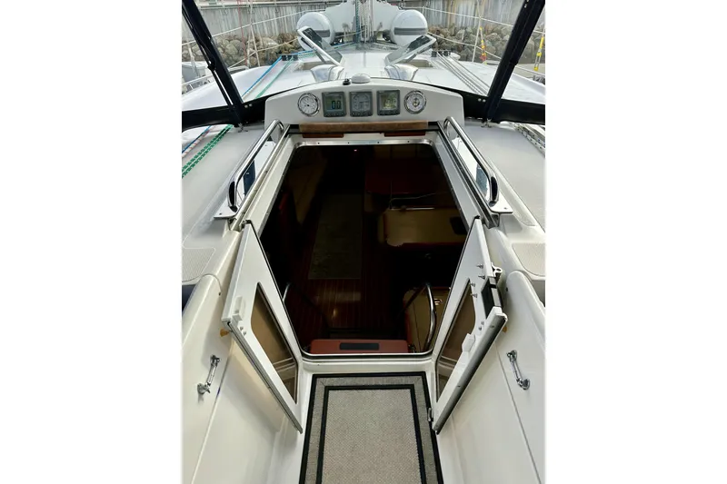 Slide: The Image of 2008 Hunter 49 yacht cockpit with open cabin door, showcasing interior seating area. - 45