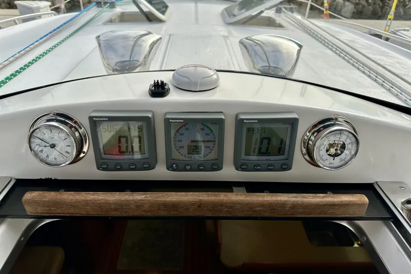 Slide: The Image of Control panel of a 2008 Hunter 49 sailboat with navigation instruments. - 46