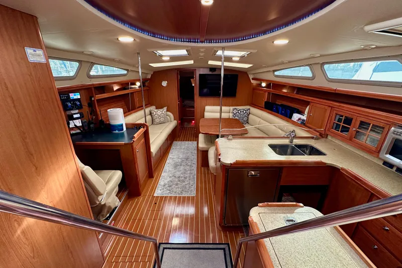 Slide: The Image of Luxurious interior of a 2008 Hunter 49 yacht with modern amenities and wood finishes. - 48