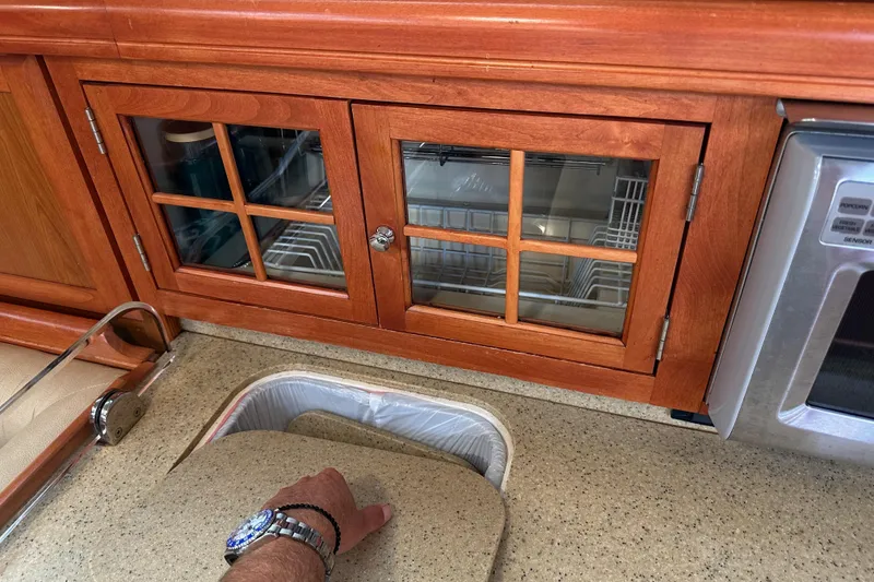 Slide: The Image of Wooden kitchen cabinetry in a 2008 Hunter 49 yacht, featuring a countertop and sink. - 55