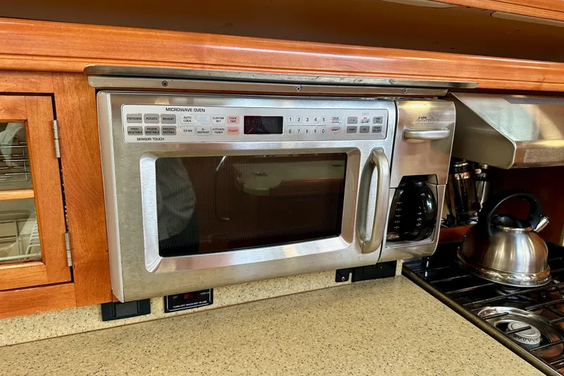 Slide: The Image of Built-in microwave and coffee maker in a 2008 Hunter 49 yacht kitchen. - 56