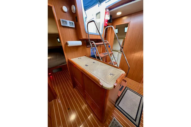 Slide: The Image of Interior of 2008 Hunter 49 yacht with wooden flooring and compact design. - 58