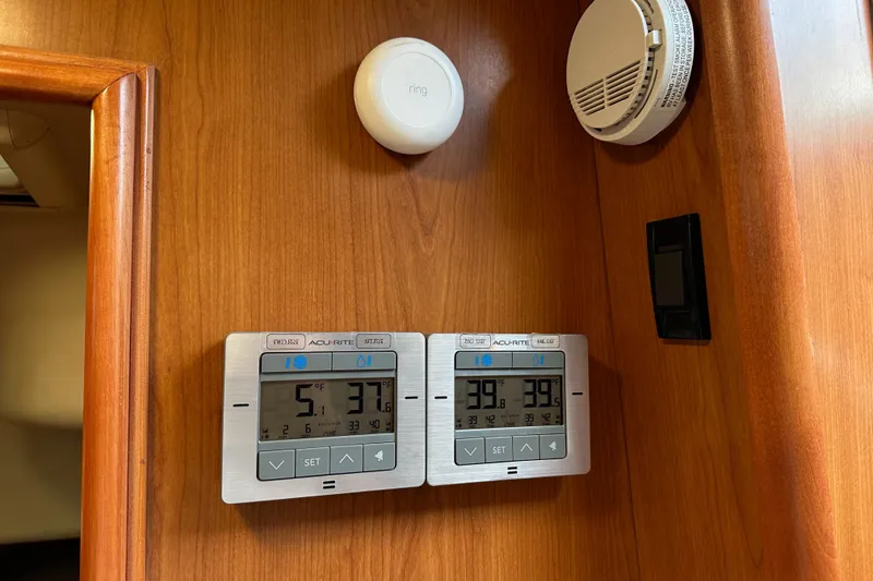 Slide: The Image of Control panel and sensors on 2008 Hunter 49 wooden interior wall. - 60