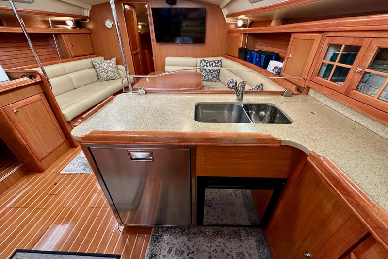 Slide: The Image of Luxurious 2008 Hunter 49 yacht interior with modern kitchen and cozy seating area. - 69