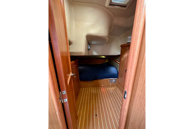 Slide: The Image of Interior cabin of 2008 Hunter 49 yacht with wooden finish and cozy bed. - 76