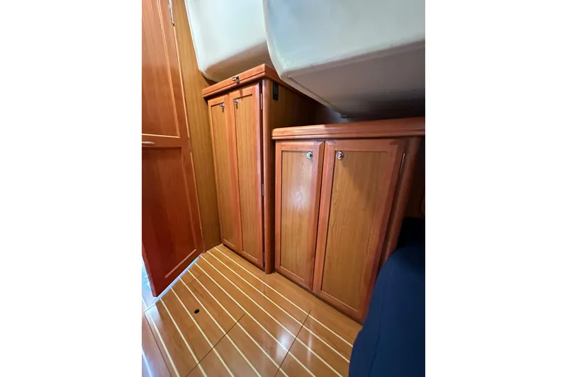 Slide: The Image of Interior of 2008 Hunter 49 yacht with wooden cabinets and flooring. - 81