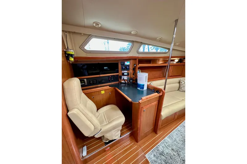 Slide: The Image of Interior of 2008 Hunter 49 yacht with navigation station and seating area. - 86