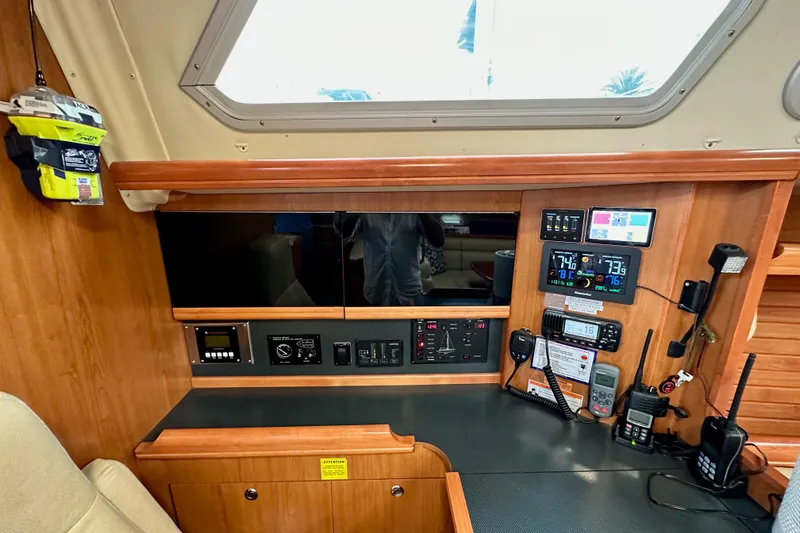 Slide: The Image of Control panel of a 2008 Hunter 49 yacht with navigation and communication equipment. - 87