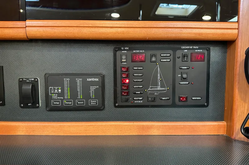 Slide: The Image of Electrical control panel on a 2008 Hunter 49 yacht, featuring Xantrex system. - 89