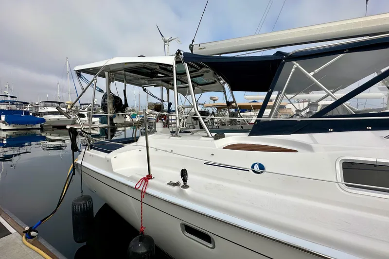 Slide: The Image of 2008 Hunter 49 sailboat docked at marina, featuring sleek design and modern amenities. - 9