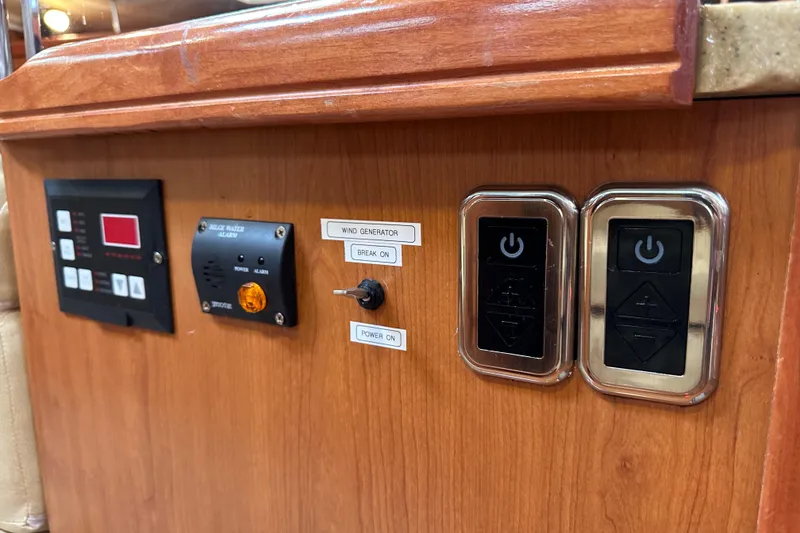 Slide: The Image of Control panel on a 2008 Hunter 49 yacht with switches and indicators. - 91