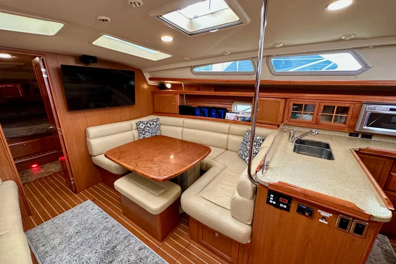 Slide: The Image of Luxurious interior of 2008 Hunter 49 yacht with dining area and kitchenette. - 92