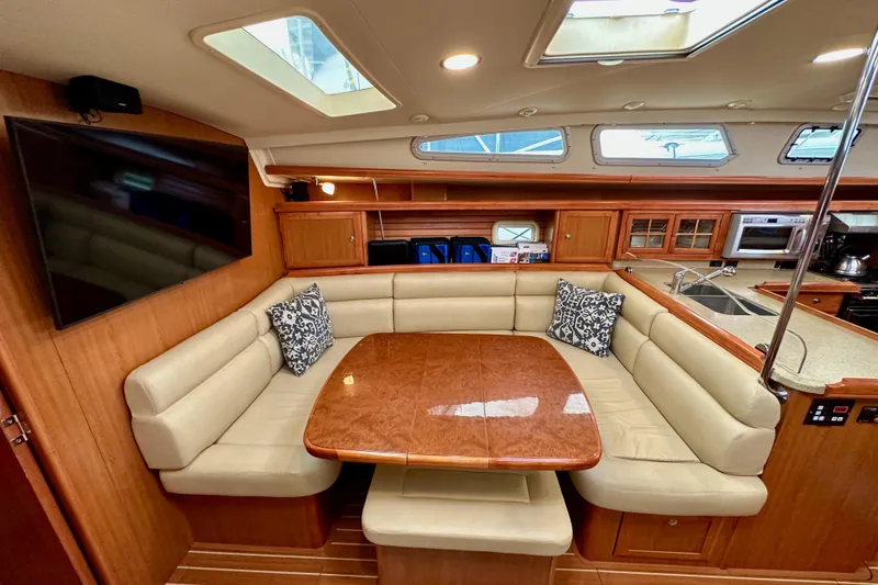 Slide: The Image of Luxurious 2008 Hunter 49 yacht interior with plush seating and modern kitchen amenities. - 93