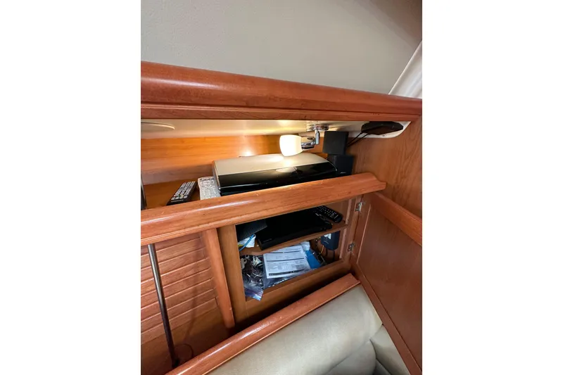 Slide: The Image of Interior of 2008 Hunter 49 yacht with wooden cabinetry and electronic equipment. - 95